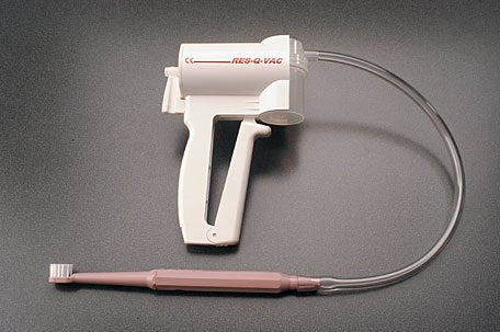 Plak-VacÂ¨ Suction Toothbrush